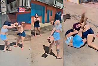 Dos perras se pelean muy fuerte por el guebo de un hombre